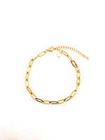 Gold chain bracelet on a white background