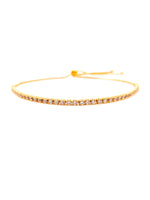 Gold bracelet with small stones on a white background