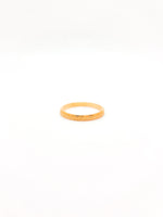 Gold ring on a white background