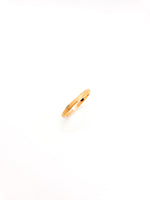 Gold ring on a white background
