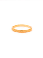 Gold ring on a white background