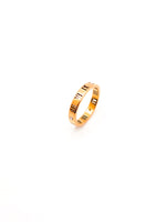 Gold ring with engraved text on a white background