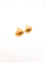 Gold shell-shaped earrings on a white background