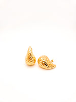 Gold teardrop-shaped earrings on a white background