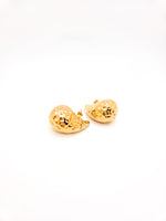 Gold earrings on a white background