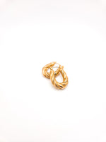 Gold hoop earrings on a white background