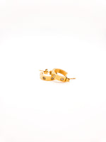 Gold hoop earrings with small stones on a white background