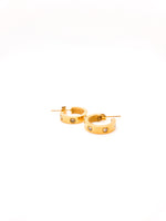 Gold hoop earrings with small stones on a white background