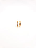 Gold hoop earrings with small diamonds on a white background