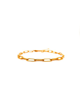 Gold chain bracelet on a white background