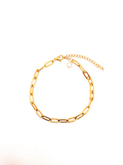 Gold chain bracelet on a white background