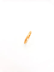 Gold ring on a white background