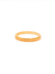 Gold ring on a white background