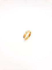 Gold ring with a small diamond on a white background