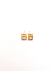 Gold square earrings with clear gemstones on a white background