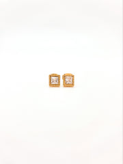Pair of square stud earrings with rose gold frame and clear gemstones on a white background