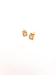 Gold square earrings with clear stones on a white background