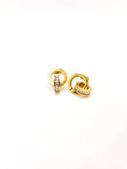 Pair of gold earrings with diamond accents on a white background