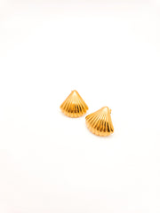 Pair of gold shell-shaped earrings on a white background
