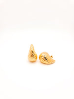 Gold teardrop-shaped earrings on a white background