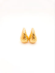 Pair of gold teardrop-shaped earrings on a white background