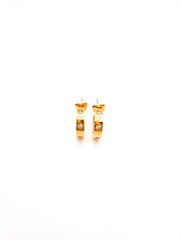 Gold hoop earrings on a white background