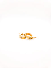Gold hoop earrings with small stones on a white background
