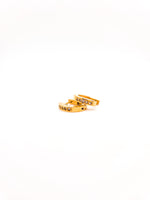 Gold hoop earrings with small stones on a white background